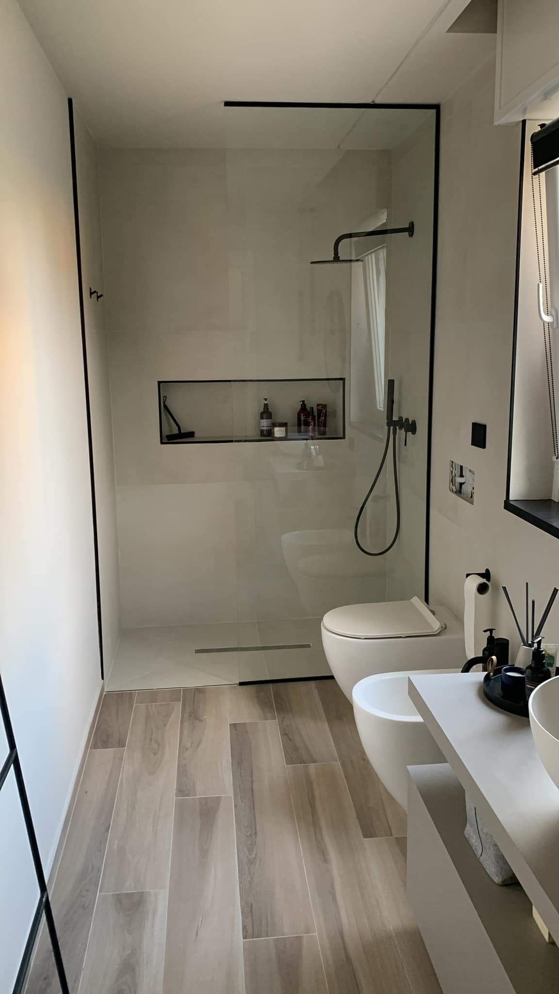 Modern bathroom renovation with walk-in glass shower