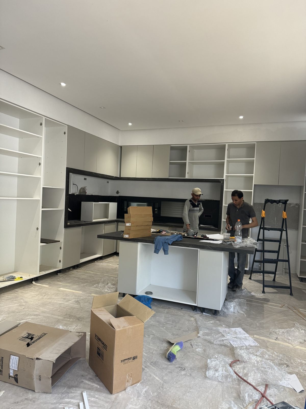 Cabinet installation in progress during a kitchen build